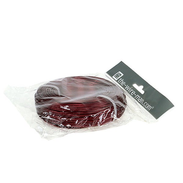 Spule aus dunkelrotem Metalldraht in einer Kunststoffverpackung von the-wire-man.com.