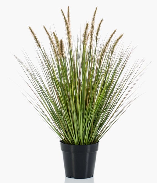 Nahaufnahme von künstlichem Ziergras mit langen, schmalen Halmen.