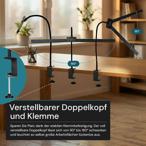Schwarze Schreibtischlampe mit verstellbarem Doppelkopf und Klemmbefestigung auf Holztisch. Schwenkbereich von 90 bis 180 Grad zur Ausleuchtung.