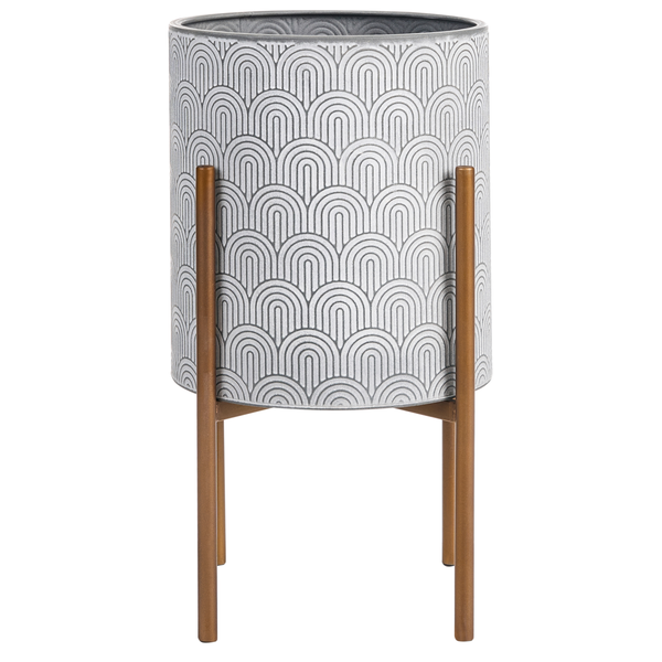 Zylindrisches Pflanzgefäß aus Metall mit geometrischem Muster auf einem Metallständer.