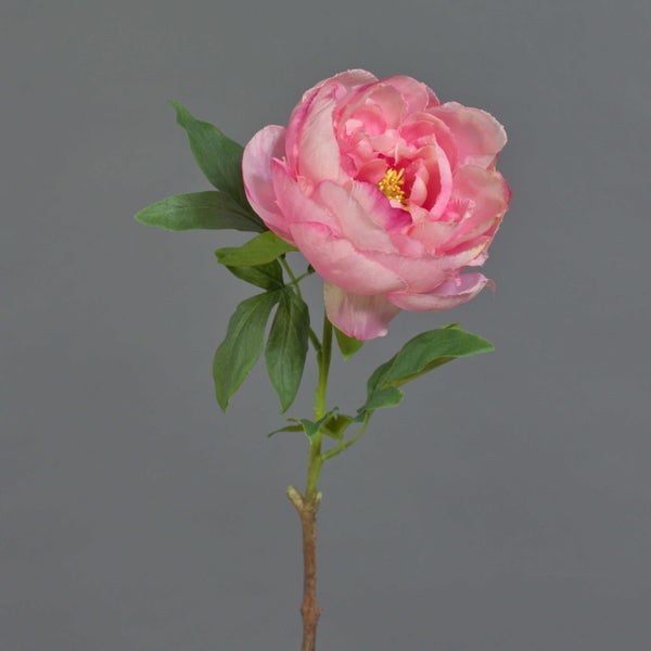 Rosa künstliche Pfingstrose aus Textil mit grünen Blättern.