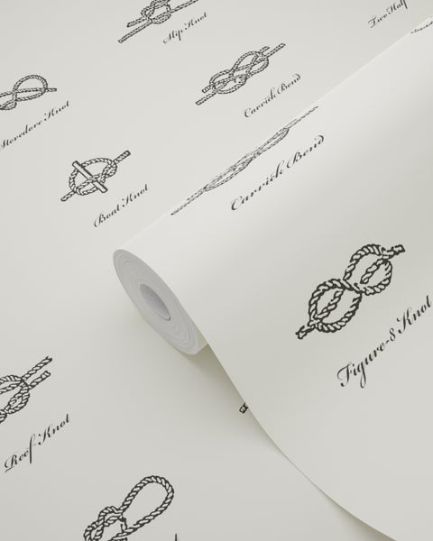 Tapetenrolle mit verschiedenen Knotenmotiven und Schriftzügen