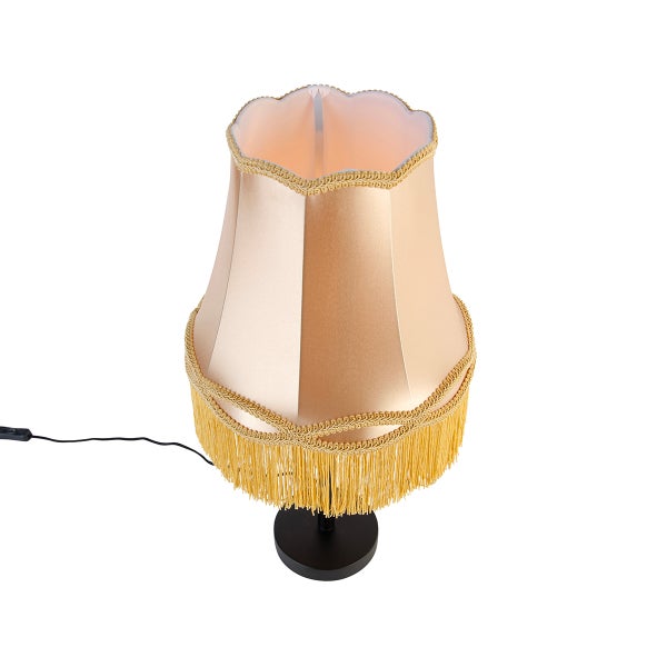 Tischleuchte mit Stoffschirm, dekorativer Borte und Fransen am unteren Rand, schwarzer runder Standfuß.