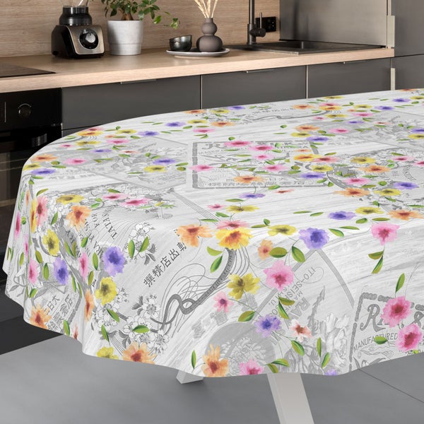 Ovale Wachstuchtischdecke mit buntem Blumenmuster und Vintage-Design in einer modernen Küche.