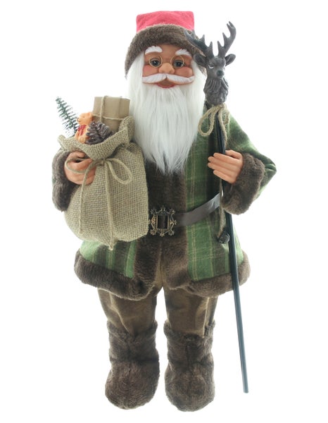 Dekorativer Weihnachtsmann mit Geschenkesack und Hirschkopf-Spazierstock als festliche Dekoration