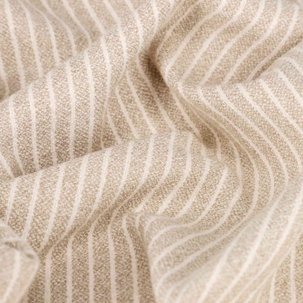 Nahaufnahme eines beigen Stoffes mit Streifen