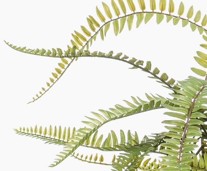 Nahaufnahme des grünen Stiels einer Kunstblume mit Blättern aus Textilmaterial.