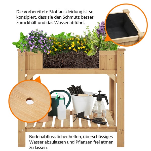 Hochbeet mit verschiedenen Gartenwerkzeugen und Pflanzen