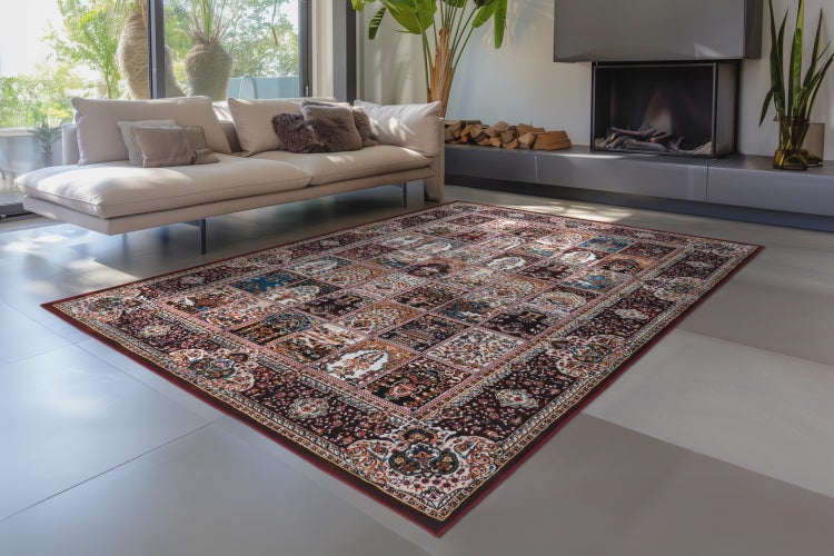 Ein Orientteppich mit orientalischem Muster liegt im modernen Wohnzimmer vor einem Kamin.