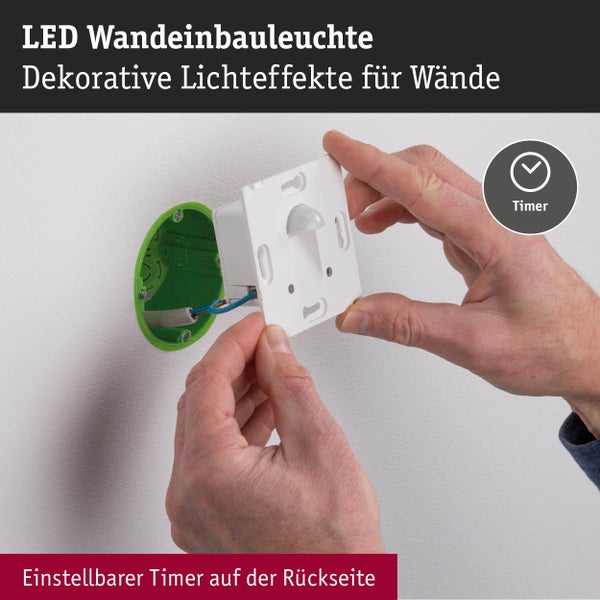 Installation einer LED-Wandeinbauleuchte in eine Wanddose mit einstellbarem Timer auf der Rückseite.