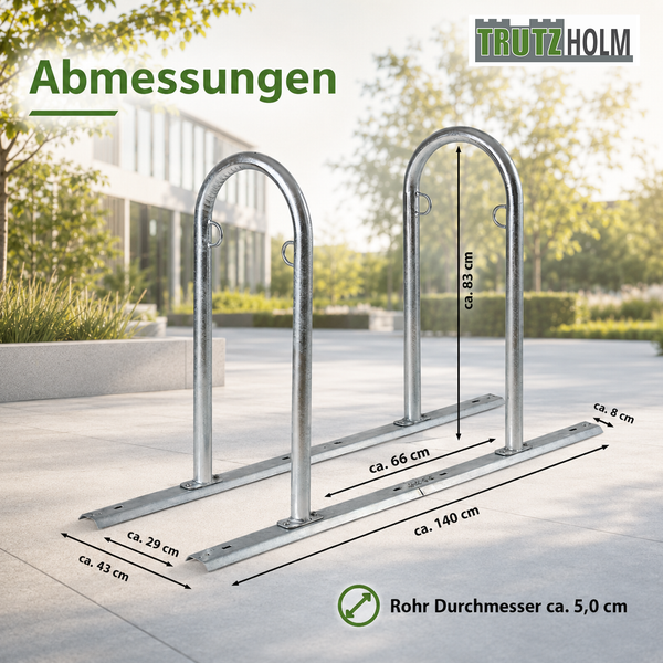 Fahrradständer aus Metall: Höhe circa 83 Zentimeter, Länge circa 140 Zentimeter, Rohrdurchmesser circa 5,0 Zentimeter. Trutzholm Logo.