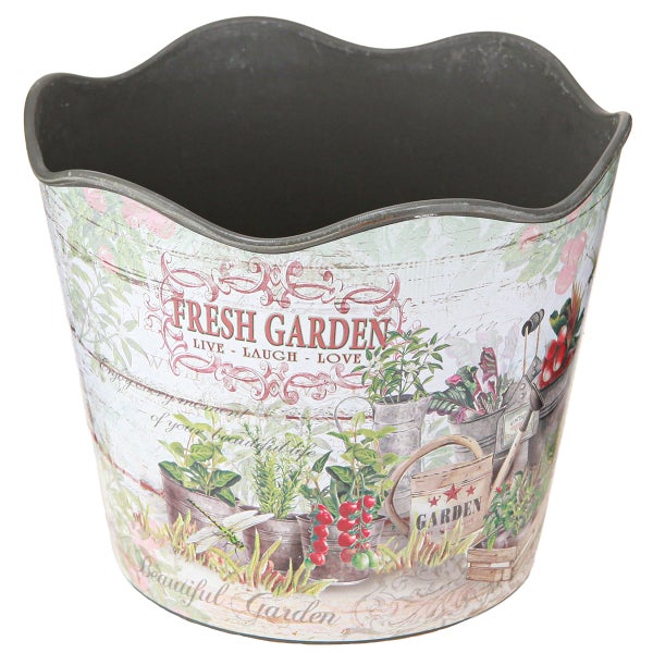 Detailansicht eines Zink-Übertopfes mit dekorativem Aufdruck Fresh Garden und botanischen Motiven.