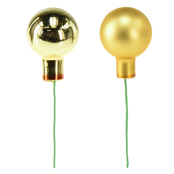 Zwei goldfarbene Christbaumkugel-Picks