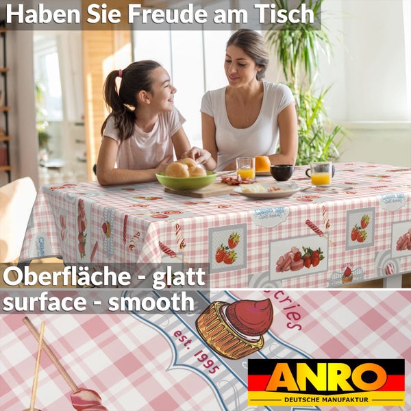 Tischdecke mit Erdbeermuster und Mädchen mit Frau am Tisch