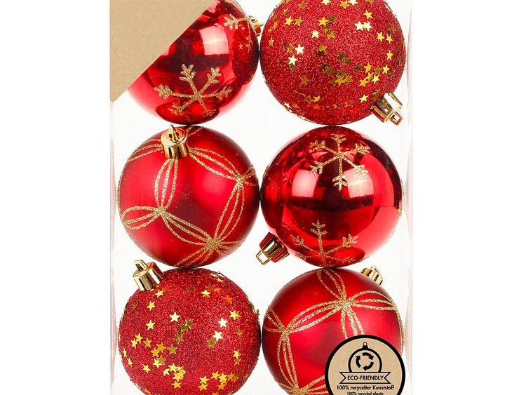 Set mit sechs Weihnachtskugeln aus Kunststoff mit unterschiedlichen Verzierungen wie Sternen und Schneeflocken in einer Verpackung.