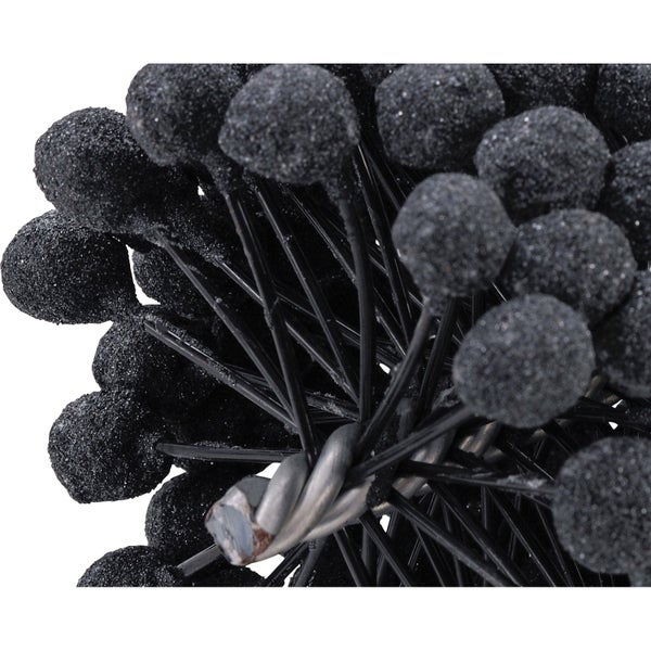 Dekorative Kunstblume mit schwarzen Kugeln