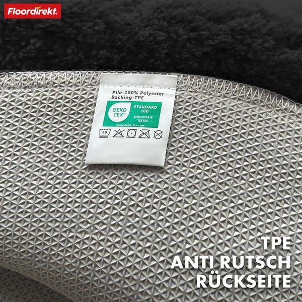 Detailansicht eines Teppichs mit OEKO-TEX Standard 100 Siegel und TPE-Antirutsch-Rückseite