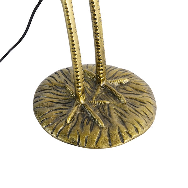 Detailaufnahme des Fußes und der Beine einer Stehlampe in Form eines Vogels