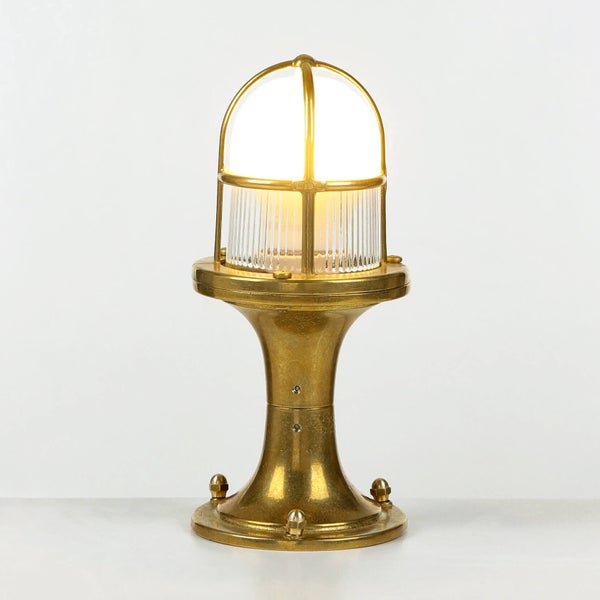 Goldene Tischleuchte mit transparentem Schirm für den Innenbereich