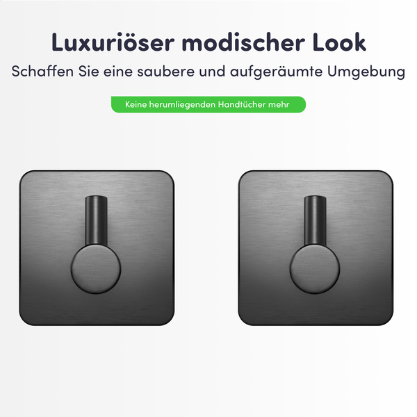 Zwei quadratische Handtuchhaken aus dunklem gebürstetem Metall für ein ordentliches Badezimmer.