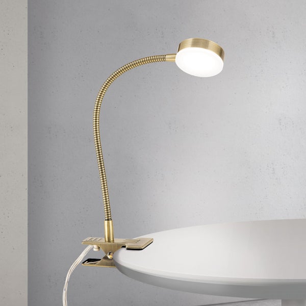 Klemmleuchte mit flexiblem Arm und LED-Lichtquelle auf einem Tisch