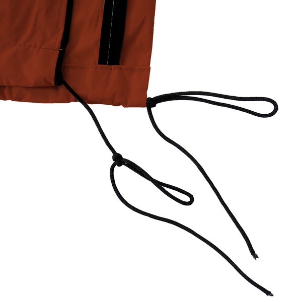 Detailaufnahme eines orangefarbenen Stoffes mit schwarzen Kordeln und Reißverschluss