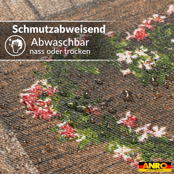 Schmutzabweisende und nass oder trocken abwaschbare Oberfläche mit Wassertropfen auf floralem Muster, ANRO Logo.
