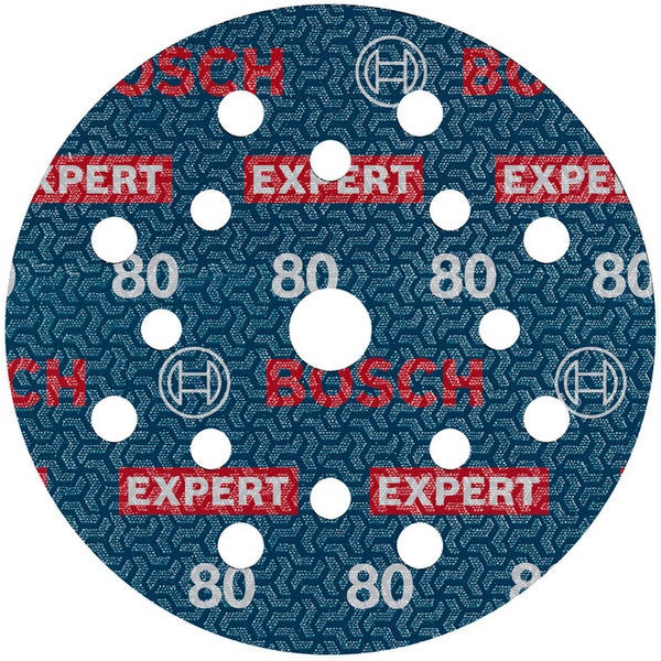 Hand mit Schutzhandschuh bedient Exzenterschleifer auf Holzoberfläche