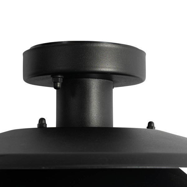 Schwarze Deckenbefestigung einer Lampe aus Metall.
