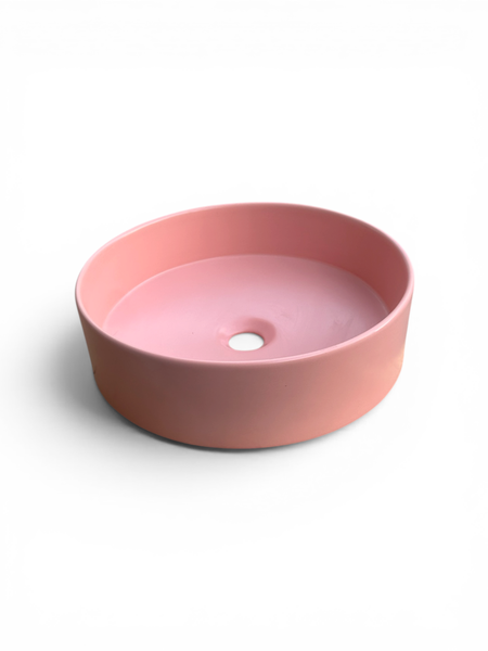 Rundes Aufsatzwaschbecken aus Keramik in Rosa.