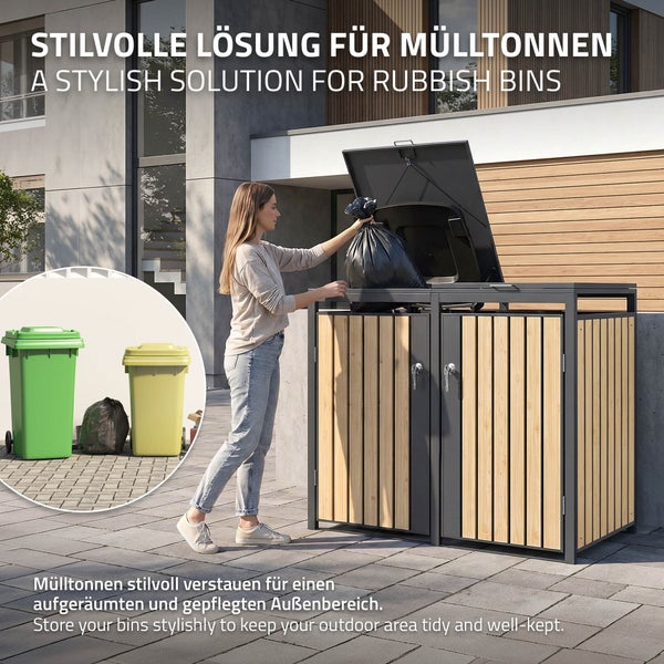 Eine Frau entsorgt einen Müllbeutel in einer modernen Mülltonnenbox für zwei Tonnen aus Metall und Holzlamellen im Außenbereich.