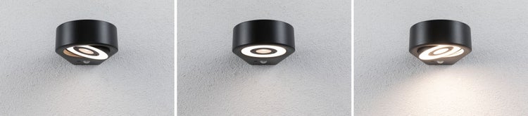 Schwarze LED Außenwandleuchte mit Bewegungsmelder, verstellbarer Lichtkopf in drei Positionen an einer Wand.