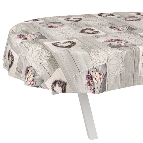 Ovale Tischdecke mit Holzoptik-Druck, Herzmotiven aus Blüten und Spitzenornamenten.
