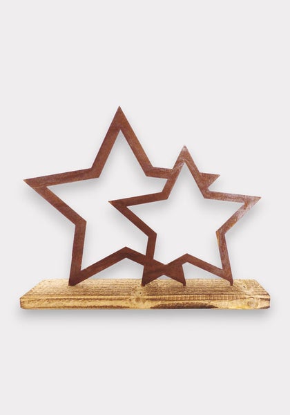 Dekoration mit zwei Sternen aus Metall auf Holzsockel
