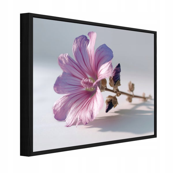 Gerahmtes Wandbild mit einer Makroaufnahme einer rosa Blüte in einem schwarzen Rahmen.