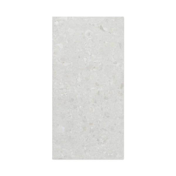 Rechteckige Wandfliese oder Bodenfliese in Terrazzo Optik mit einer dezenten Steinstruktur für Innenbereiche