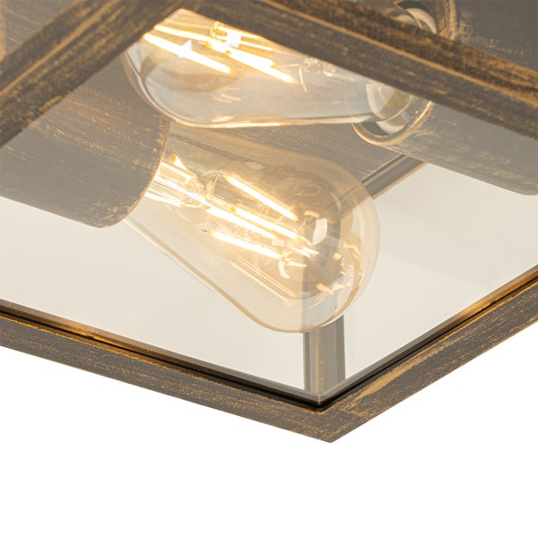 Deckenleuchte mit antikem Metallrahmen und zwei eingeschalteten LED-Filament-Leuchtmitteln hinter Klarglas.