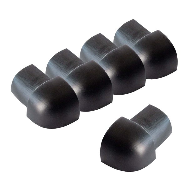 Vier schwarze Eckenschutz-Kappen aus Gummi für Möbelkanten.