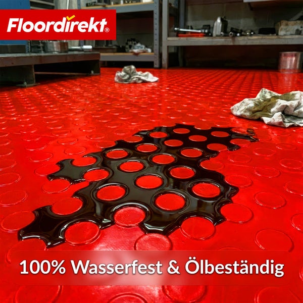 Roter Bodenbelag mit Ölresten und Floor direkt Logo