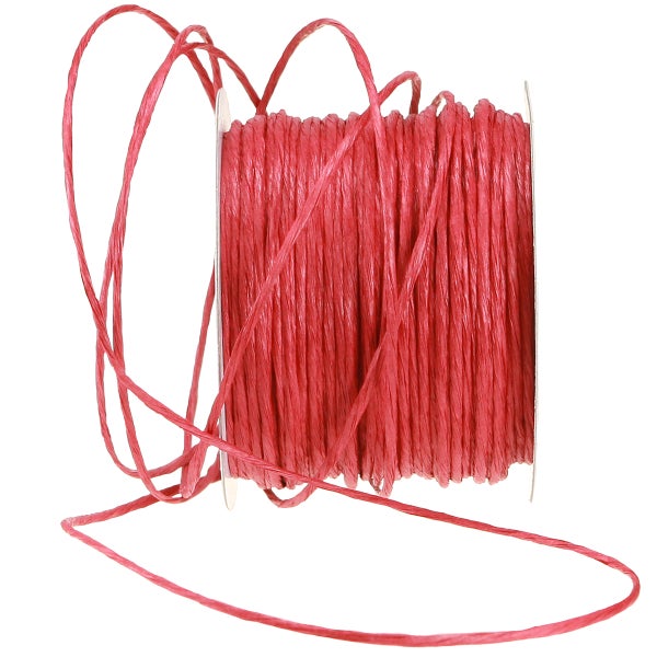 Rote Bastkordel auf einer Spule für Bastelarbeiten und Dekorationen aus Papier.