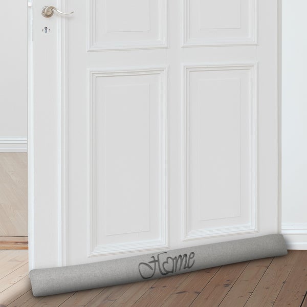 Textiler Türluftstopper mit Schriftzug Home vor einer Tür