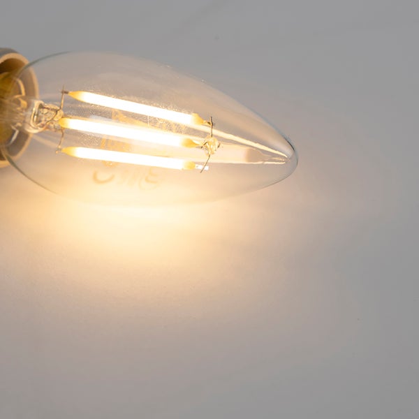 Leuchtendes LED-Filament-Leuchtmittel in Kerzenform aus klarem Glas.