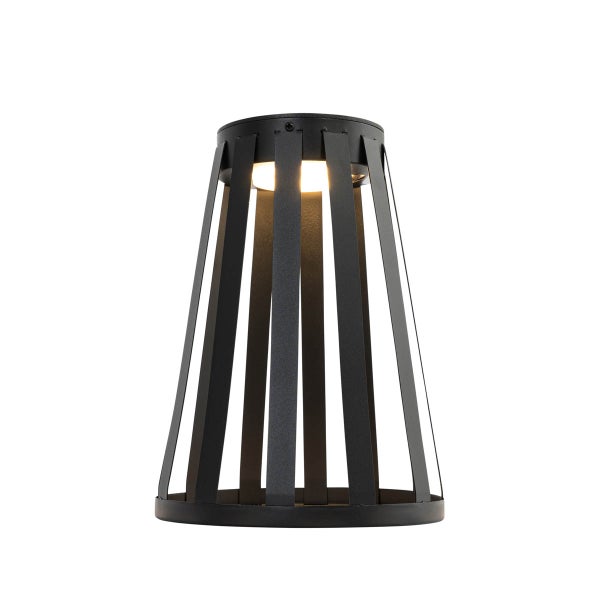 Moderne schwarze Tischleuchte aus Metallstreben in konischer Form mit warmem Licht.