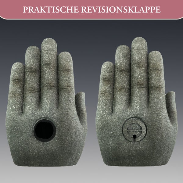 Steindekoration in Handform mit einer praktischen Revisionsklappe in der Handfläche.