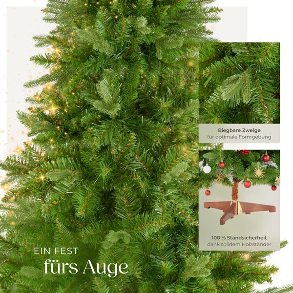 Detailaufnahme eines grünen künstlichen Weihnachtsbaums mit biegsamen Zweigen und einem stabilen Holzständer