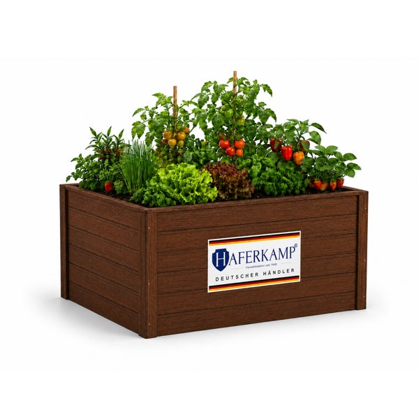 Haferkamp Hochbeet aus Holz, bepflanzt mit Gemüse wie Tomaten und Salat.