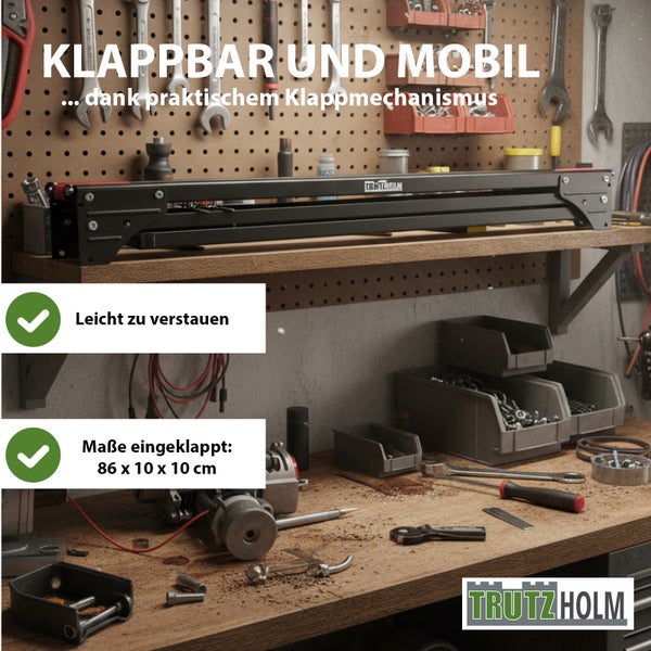 Klappbarer Trutzholm Arbeitstisch im zusammengeklappten Zustand auf einem Werkstattregal. Maße 86 mal 10 mal 10 Zentimeter. Trutzholm Logo.