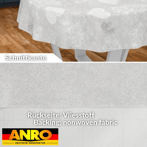 Rundes Wachstuch mit Blumen- und Herzmuster, Schnittkante, Rückseite aus Vliesstoff, ANRO Deutsche Manufaktur Logo.