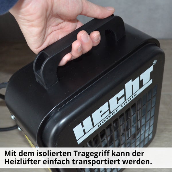 Hand hält Heizlüfter am Tragegriff von Hecht