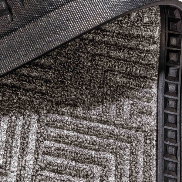 Detailaufnahme einer Fußmatte mit Muster und Gummirand